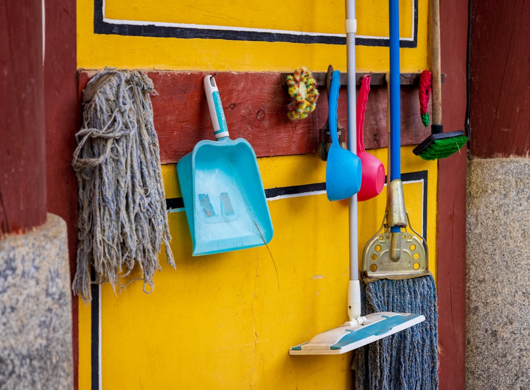 a-yellow-wall-with-a-blue-and-white-towel-from-it-bvrjbcmn0eu